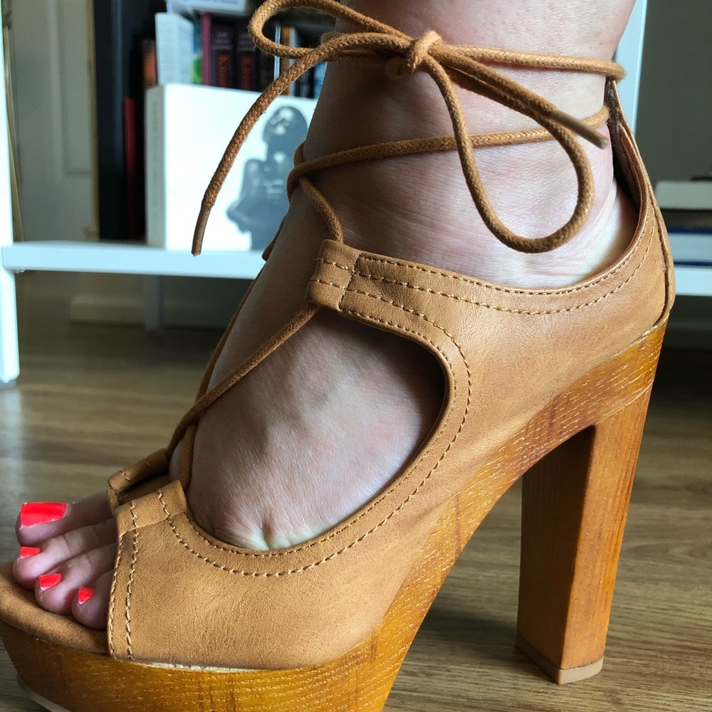 Tan lace up heals.